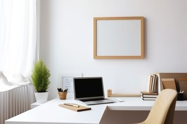 Minimalist home office featuring clean white decor and modern workspace setup. Desktop includes a laptop, houseplant, and office supplies, promoting productivity and simplicity. Ideal for articles on efficiency, interior design, remote work, office setup, and minimalist lifestyle.