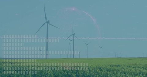 Large wind turbines over lush green fields embracing sustainable energy