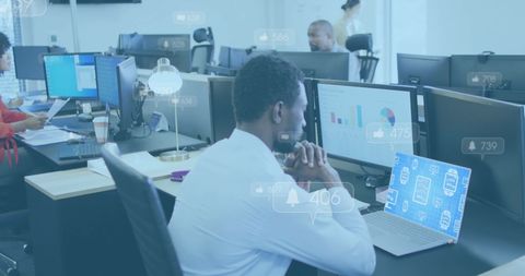 Businessman Analyzing Social Media Notifications on Laptop