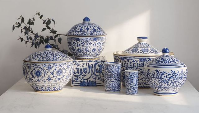 Hand-painted blue and white porcelain jars with arabic calligraphy and floral motifs