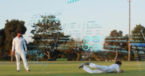 Cricket fielder diving for catch on grassy field with ar sports telemetry overlay