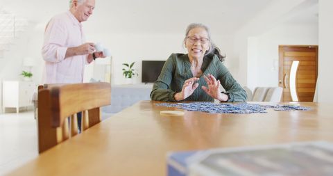 Senior Couple Enjoying Puzzle Activity at Home
