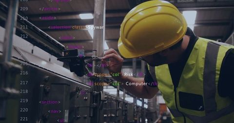 Technician adjusting conveyor controls with code overlay for smart factory automation