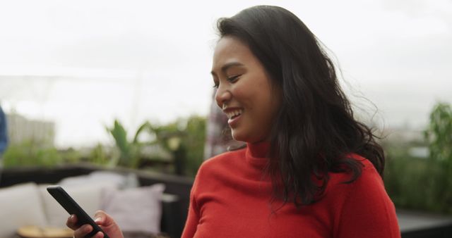 Smiling Woman Enjoying Smartphone on Rooftop Terrace - Download Free Stock Images Pikwizard.com