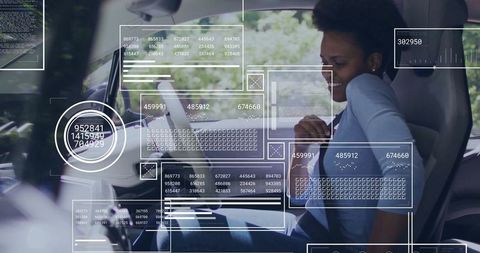 Woman in car connected to futuristic digital interface