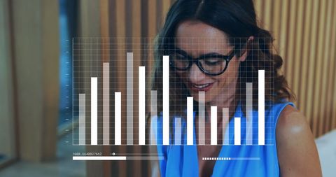 Businesswoman Smiling While Analyzing Digital Graphs