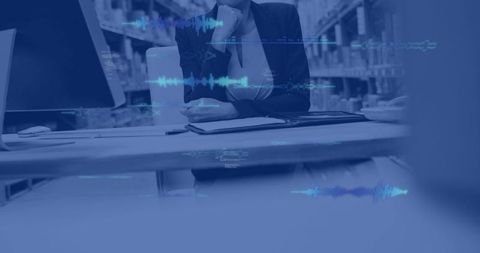 Contemplative businesswoman resting chin at desk with digital waveform overlay and bookshelves