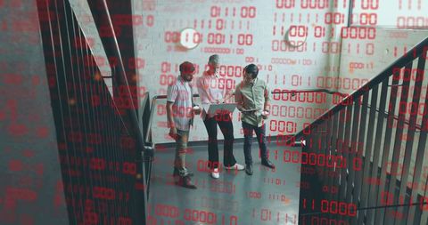 Team collaborating with digital codes overlay on staircase