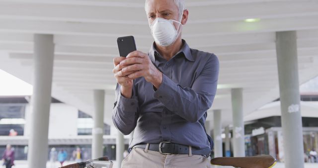 Older Man Wearing Face Mask Using Smartphone Outdoors - Download Free Stock Images Pikwizard.com