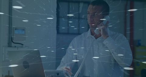 Professional in office analyzing data on laptop