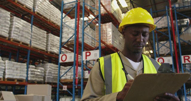 Warehouse Worker Checking Inventory on Clipboard Wearing Safety Gear - Download Free Stock Images Pikwizard.com