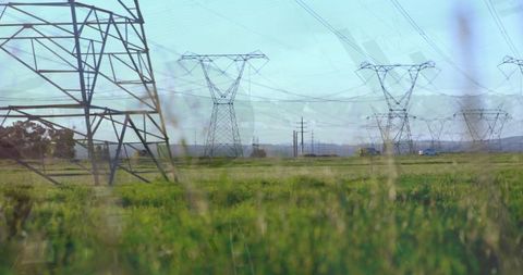 Electricity Pylons in Green Field Overlaid with Digital Data Display - Download Free Stock Images Pikwizard.com