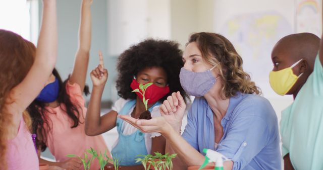 Diverse Teacher Leading Interactive Plant Lesson with Children Wearing Masks - Download Free Stock Images Pikwizard.com