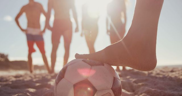 The image depicts a lively beach soccer scene, symbolizing active leisure and friendship. - Download Free Stock Photos Pikwizard.com