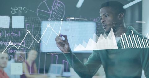 Businessman Analyzing Financial Charts in Office