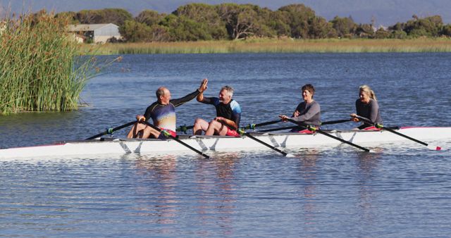 Team Rowing on Calm Lake, Celebrating Success - Download Free Stock Images Pikwizard.com