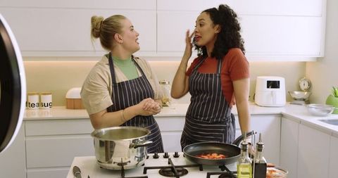 Diverse Friends Cooking in Modern Kitchen Stovetop Culinary Routine