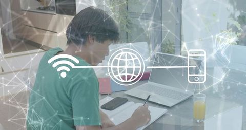 Asian man studying at home with laptop and digital network overlay for remote productivity