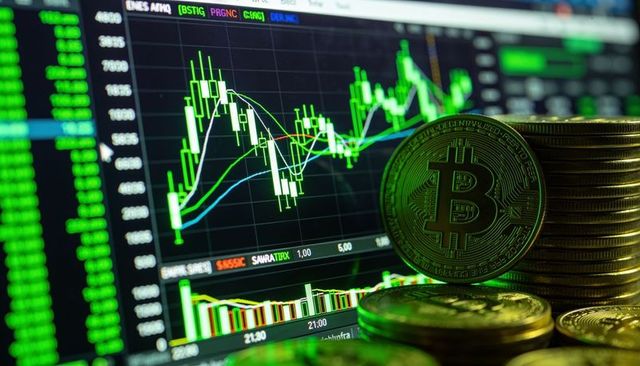 Stacked bitcoin coins with green candlestick trading charts showing market momentum