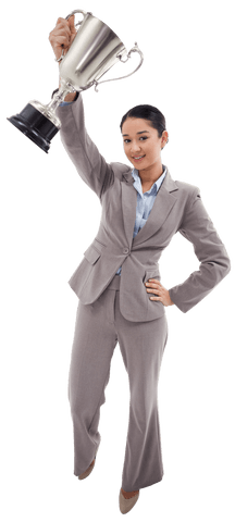 Triumphant businesswoman holding trophy against transparent background