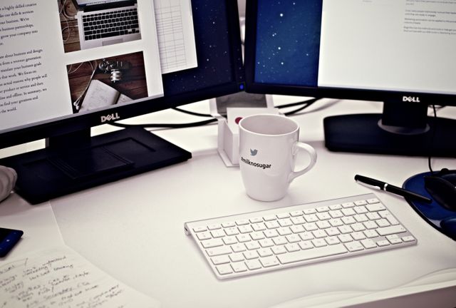 Modern Office Workspace with Dual Monitors and Coffee Cup - Download Free Stock Photos Pikwizard.com