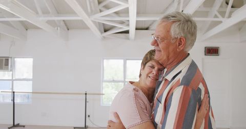 Senior Couple Embracing at Ballroom Dance Class