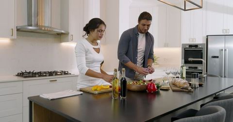Couple Cooking Together in Stylish Modern Kitchen