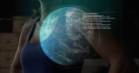 Posing woman wearing blue tank displaying holographic globe and digital code overlay