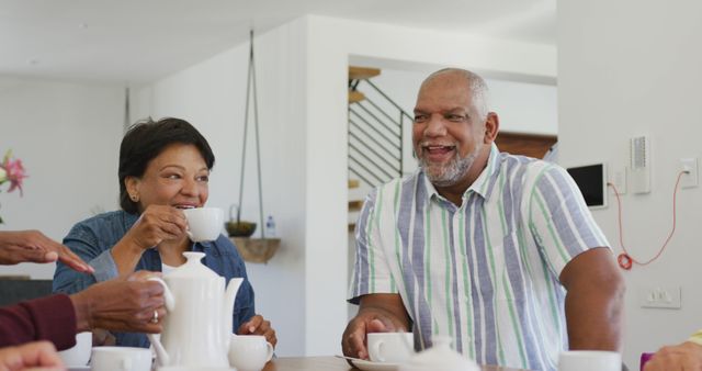 Senior Couple Enjoying Coffee with Friends at Home - Download Free Stock Images Pikwizard.com