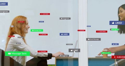 Coworkers Collaborating Across Glass Partition with Social Media Engagement Icons