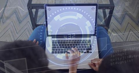 Teenager typing on laptop with guardian mentoring over couch with futuristic hud overlay