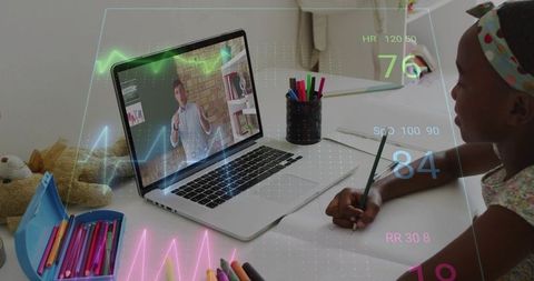 Girl studying with laptop and ar biometric overlay during virtual lesson at home