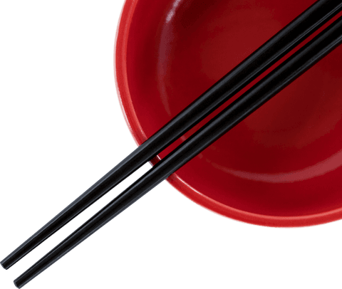 Close-up of black chopsticks on red bowl transparent background
