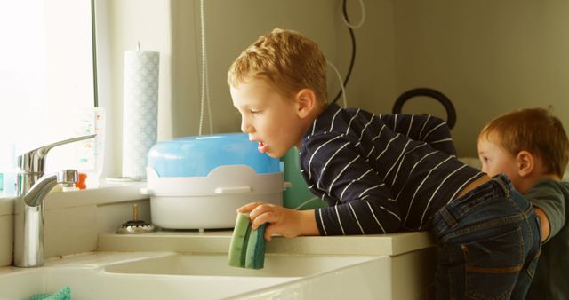 Children Exploring Kitchen Sink Learning Home Chores - Download Free Stock Images Pikwizard.com