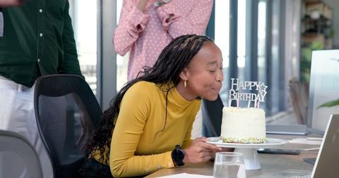 Office Birthday Celebration with Colleagues Applauding and Smiling