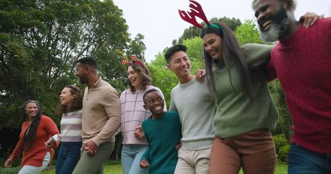 Diverse Family Celebrating Together with Linked Arms and Joyful Antics