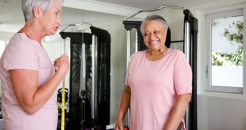 Joyful mature couple engaging in home fitness routine