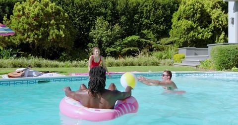 Friends enjoying poolside fun during summertime