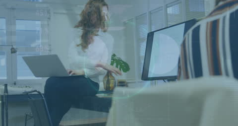 Businesswoman Analyzing Financial Data on Office Computer