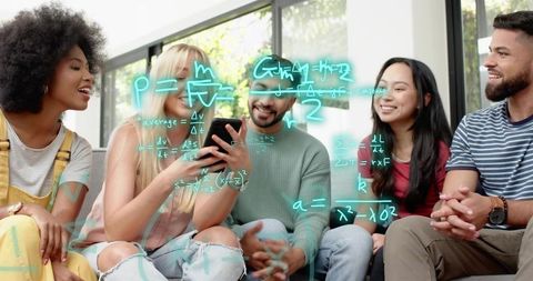Group collaborating around smartphone with math equations overlay in bright modern lounge space
