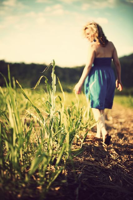 Woman Walking in Field at Sunset in Summer Dress - Download Free Stock Photos Pikwizard.com