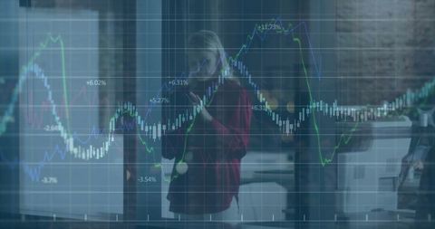 Businesswoman Analyzing Financial Charts With Technology Interface