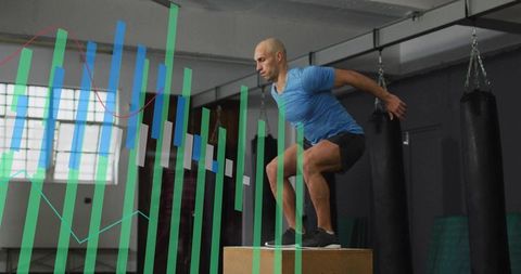 Male athlete performing plyometric box jump in gym with analytics overlay and copy space