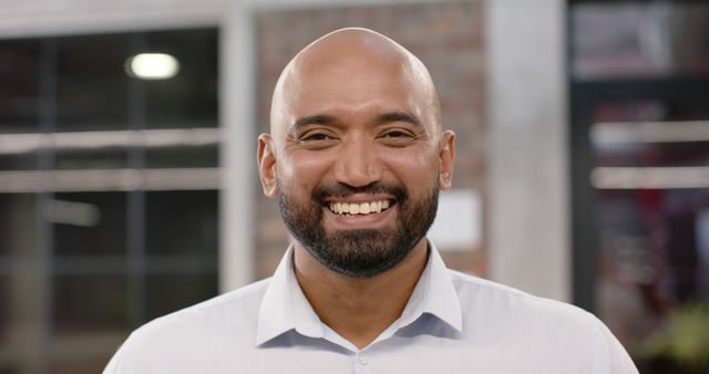 Confident Mixed Ethnicity Businessman Smiling in Modern Office - Download Free Stock Images Pikwizard.com