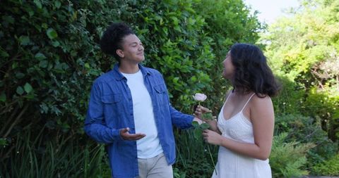 Couple Enjoying Outdoors in Lush Garden