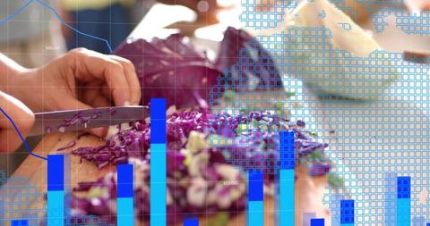 Chopping purple cabbage on cutting board with blue data overlay, cooking teamwork concept