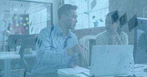 Business discussion among colleagues in modern corporate office