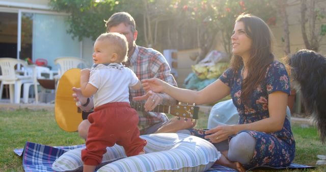 Young Parents Spending Time Outdoors with Baby and Guitar - Download Free Stock Images Pikwizard.com