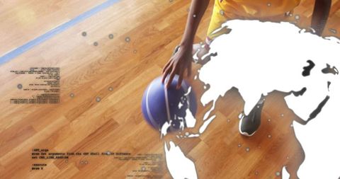 Teen athlete placing hand on basketball on wooden court with world map and code overlay