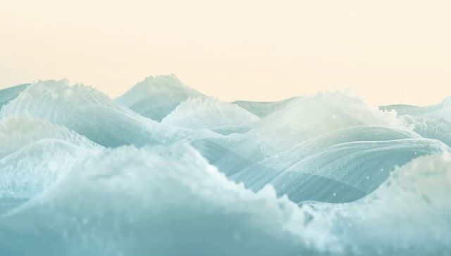 Turquoise Ocean Waves Rolling Beneath Soft Dawn Gradient Backlight with Frothy Spray